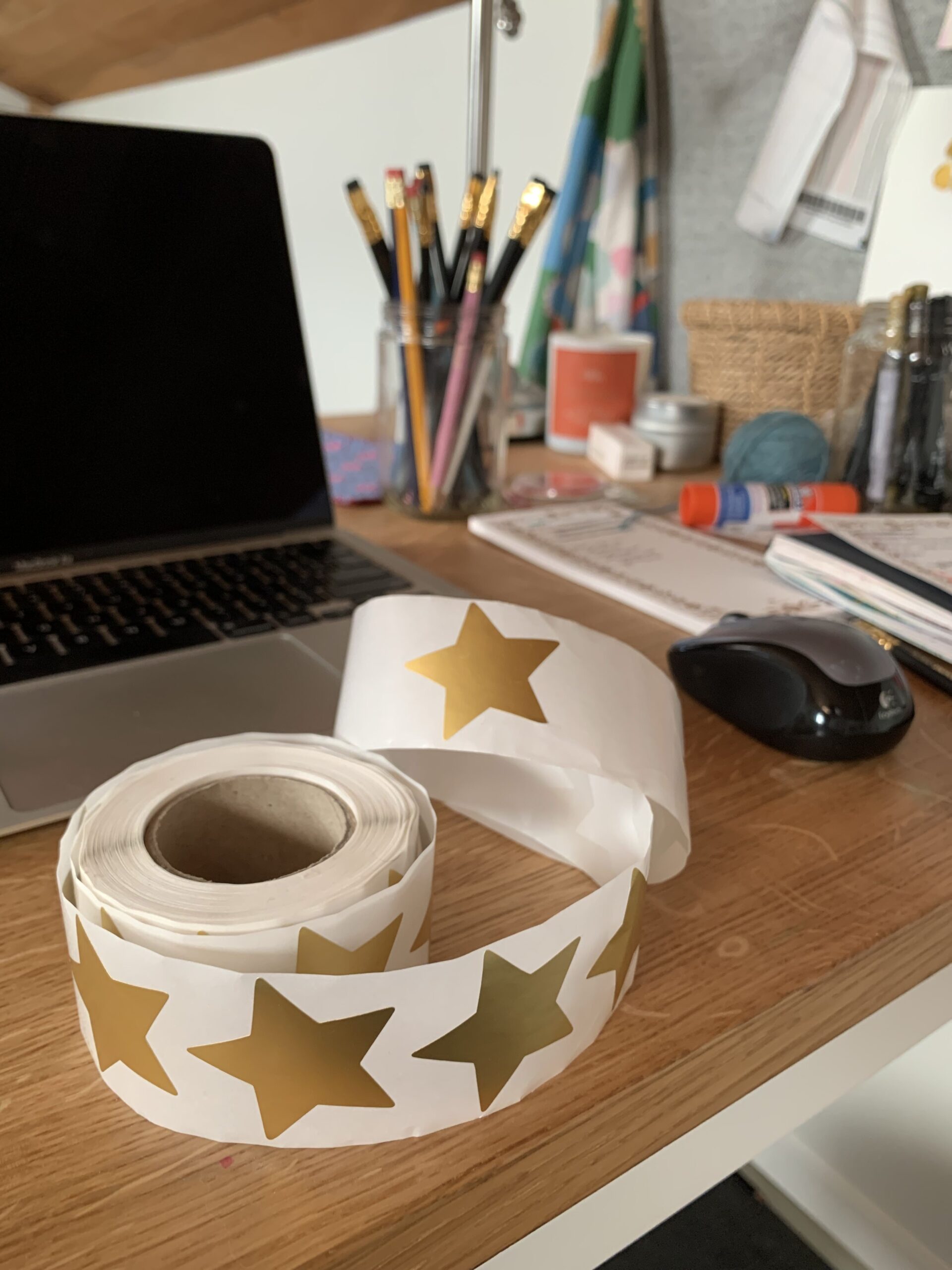 A roll of gold stars at my studio desk.